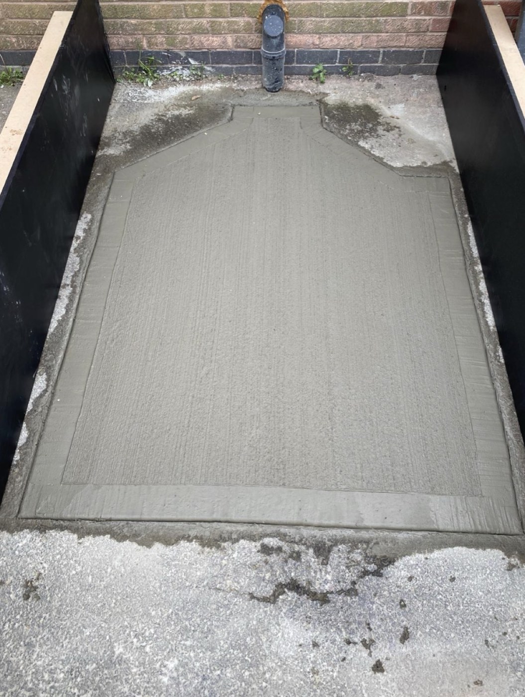 Freshly poured and tamped concrete slab