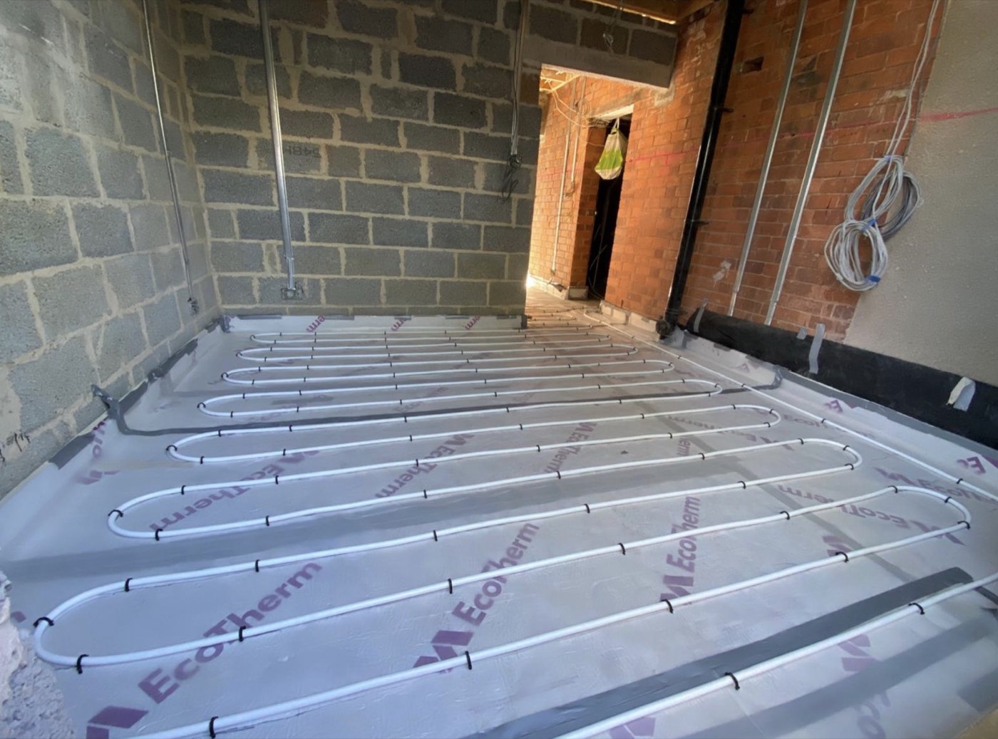 Underfloor heating pipework laid ready for screed